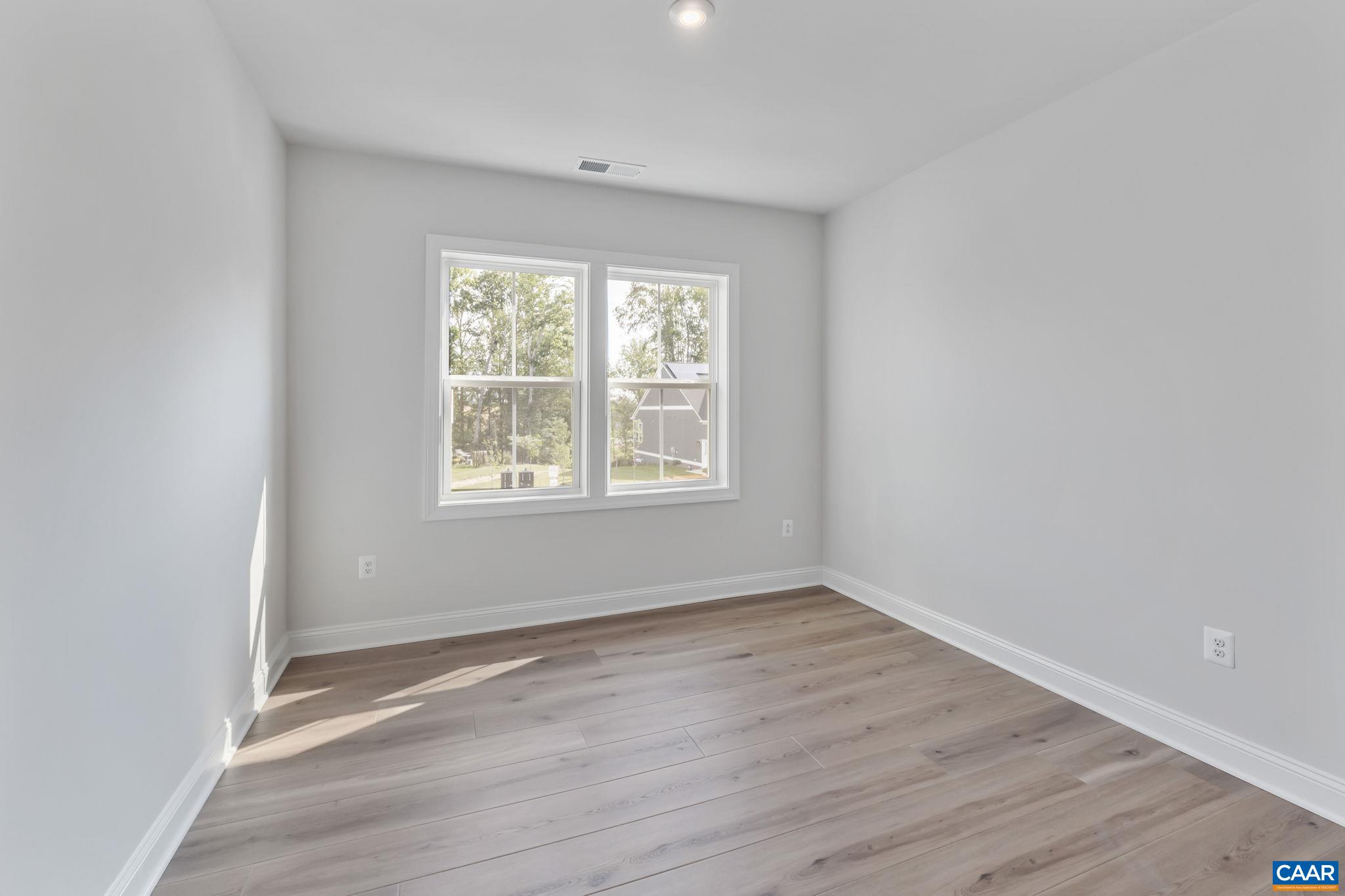 1805 Fowler Street Charlottesville, VA 22901 - Photo 44 of 60 wooden floor in an empty room with a window