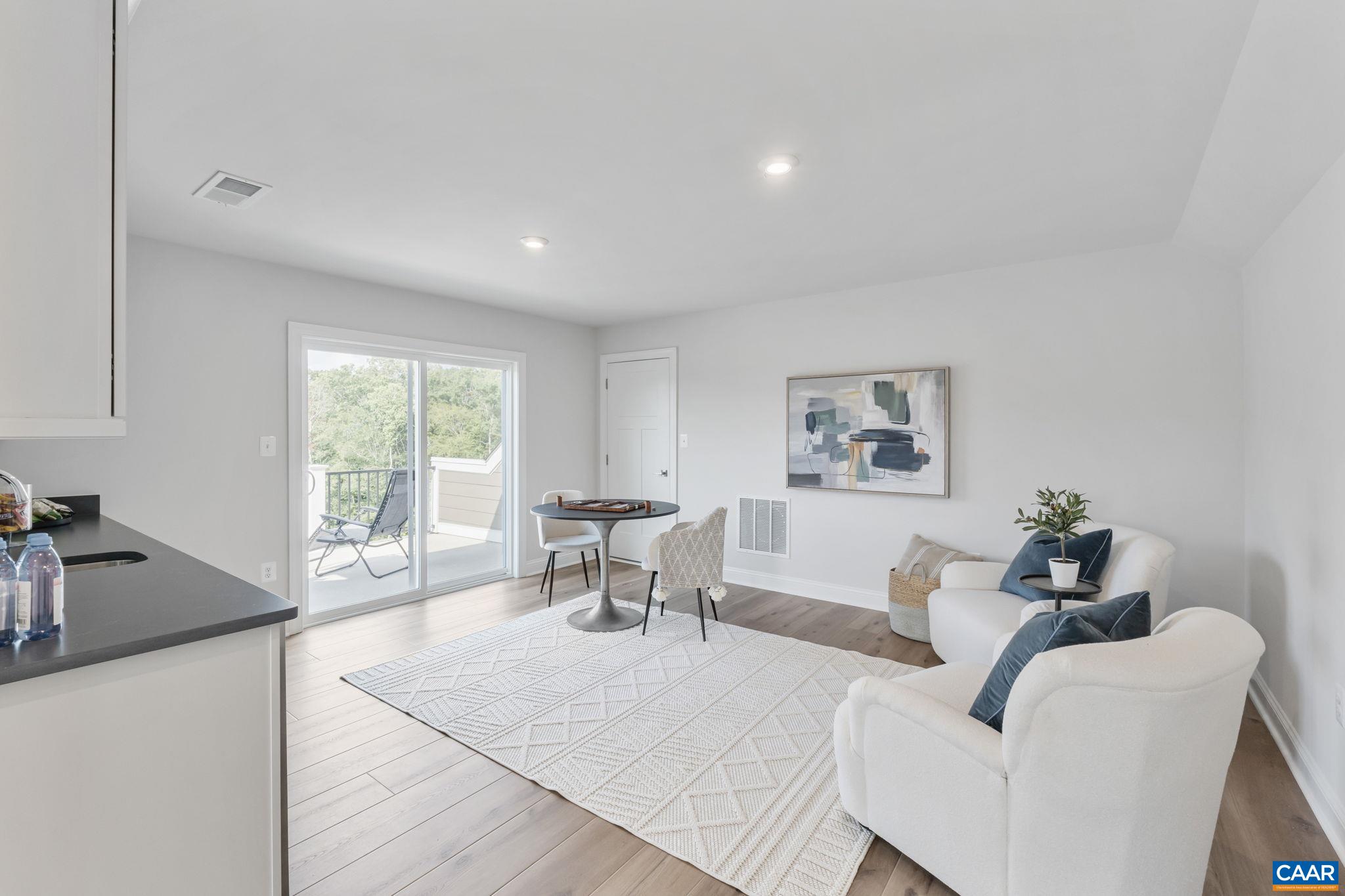 1805 Fowler Street Charlottesville, VA 22901 - Photo 49 of 60 a living room with furniture and a large window