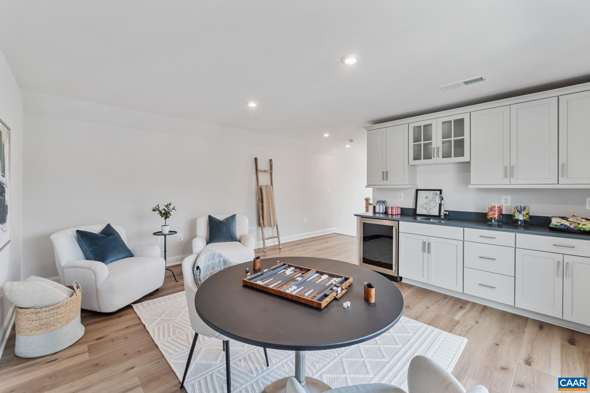 1805 Fowler Street Charlottesville, VA 22901 - Photo 50 of 60 a living room with furniture and a wooden floor