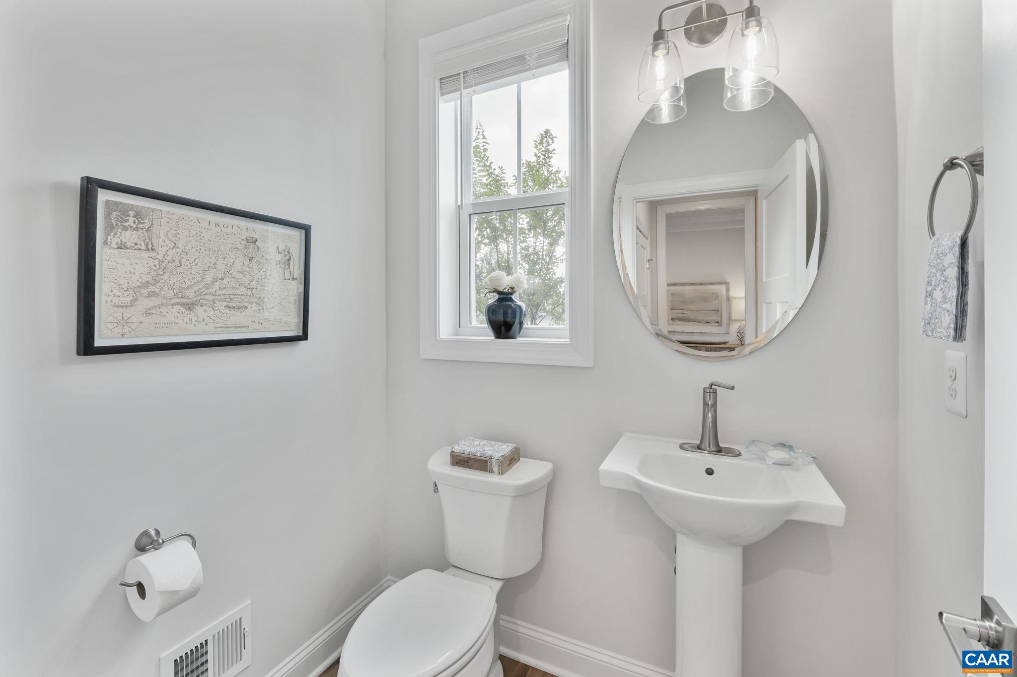 1805 Fowler Street Charlottesville, VA 22901 - Photo 8 of 60 a bathroom with a toilet sink and mirror