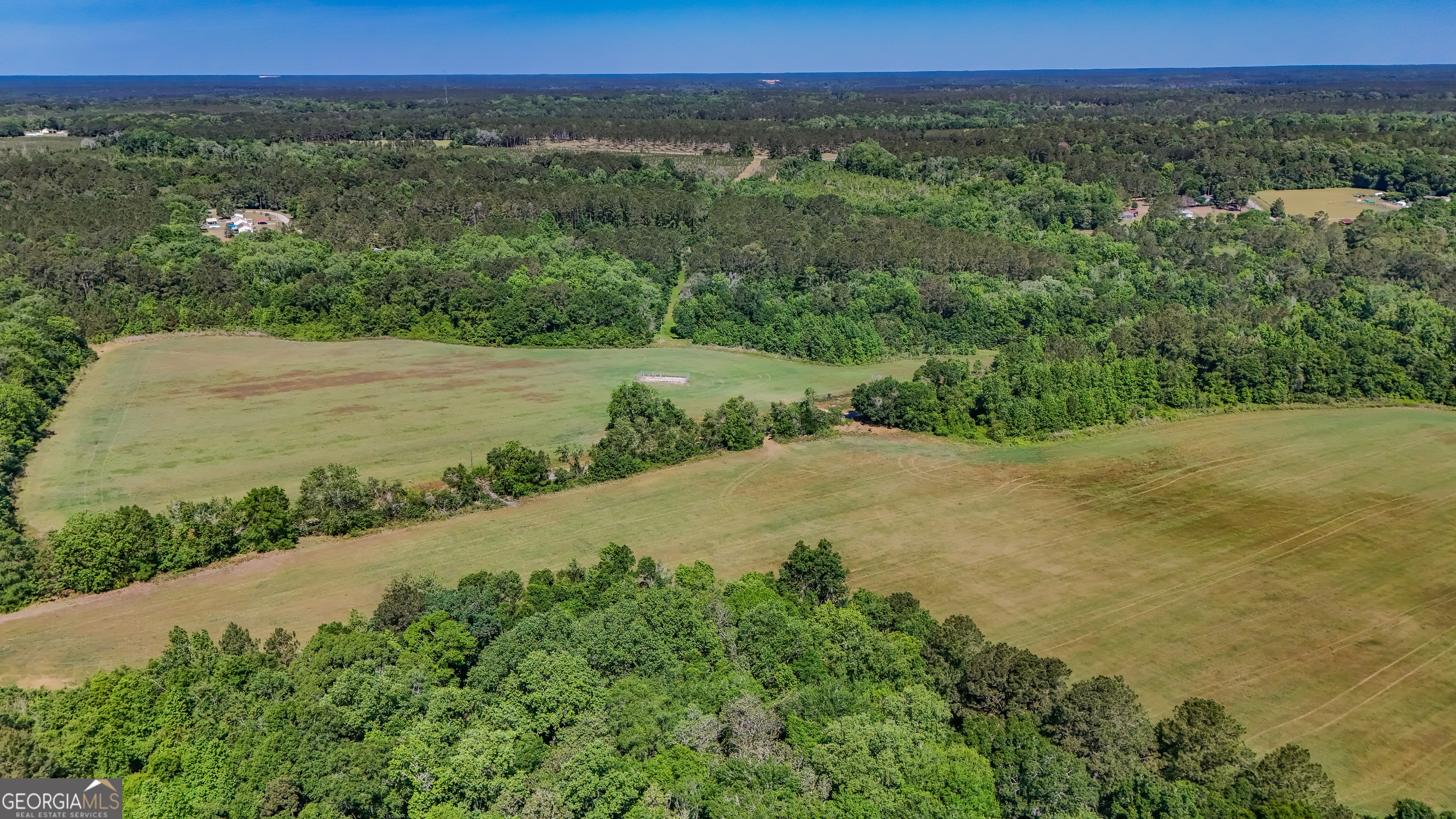 0 Darsey Road Cairo, GA 39828 - Photo 14 of 16 a view of a lush green field with two buildings in the background