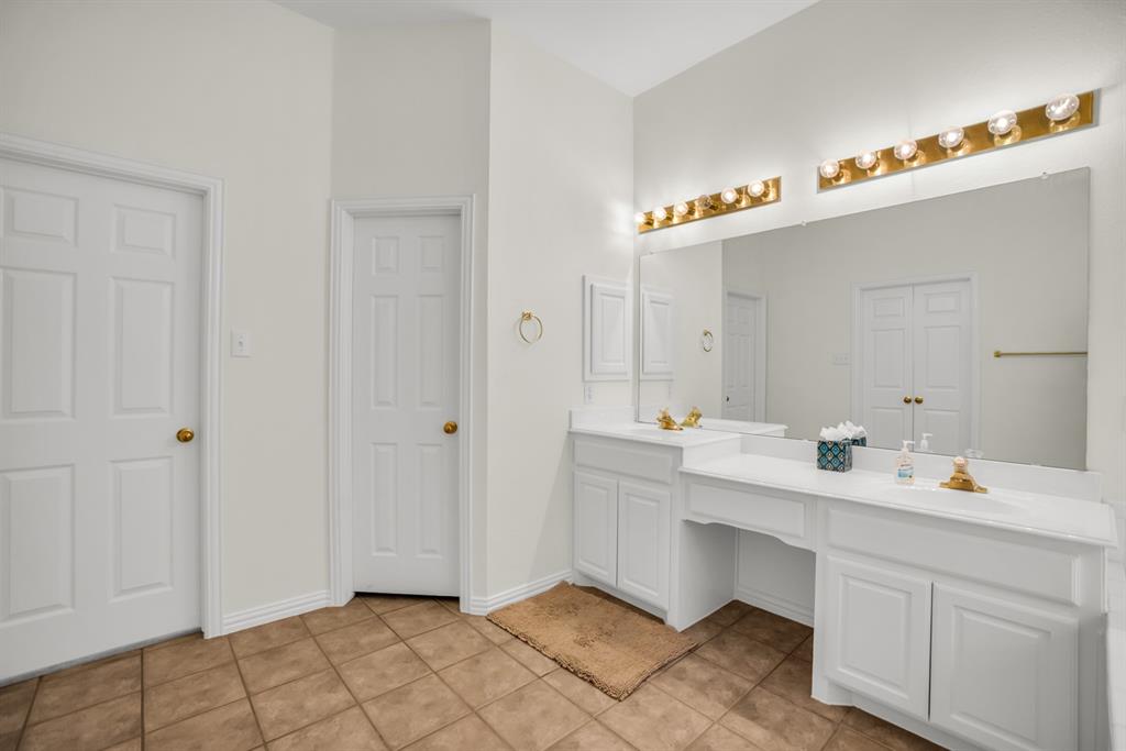 1610 Mapleleaf Falls Drive Allen, TX 75002 - Photo 23 of 36 a spacious bathroom with a double vanity sink mirror and vanity