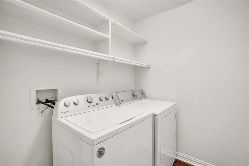 1610 Mapleleaf Falls Drive Allen, TX 75002 - Photo 25 of 36 a utility room with dryer and washer