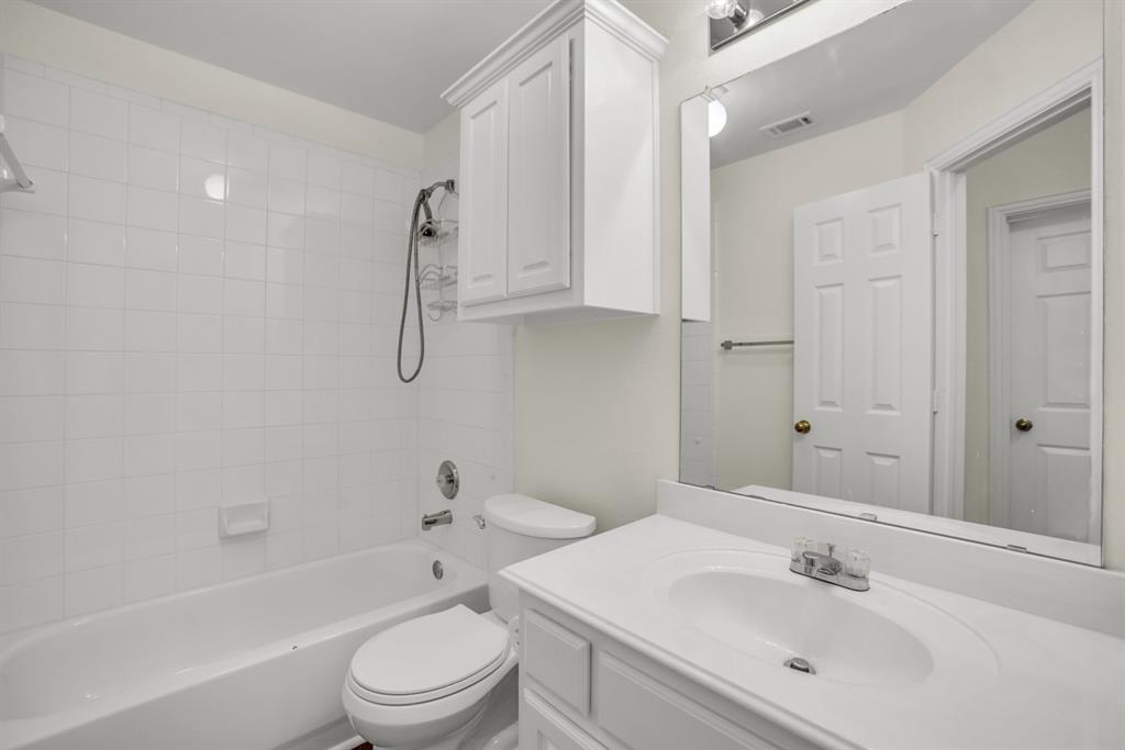 1610 Mapleleaf Falls Drive Allen, TX 75002 - Photo 26 of 36 a bathroom with a sink a toilet and shower