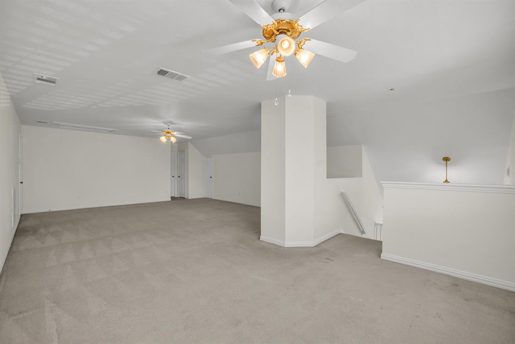 1610 Mapleleaf Falls Drive Allen, TX 75002 - Photo 30 of 36 an empty room with a ceiling fan and a window