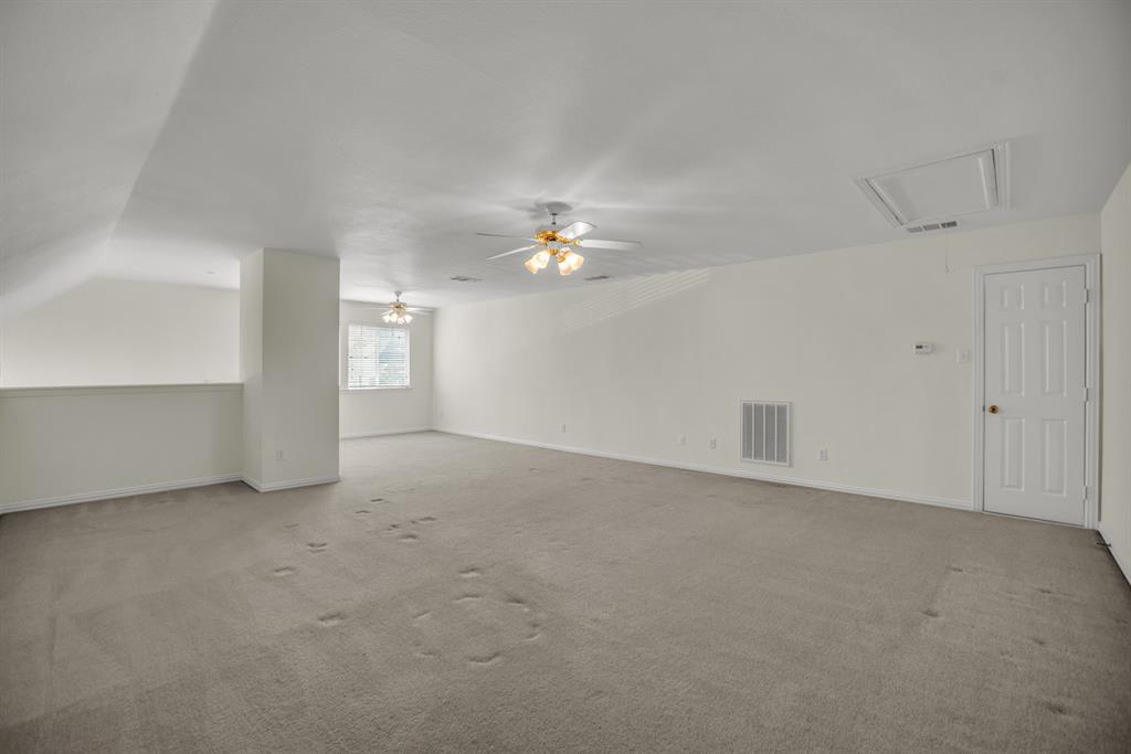 1610 Mapleleaf Falls Drive Allen, TX 75002 - Photo 31 of 36 a view of an empty room with a window