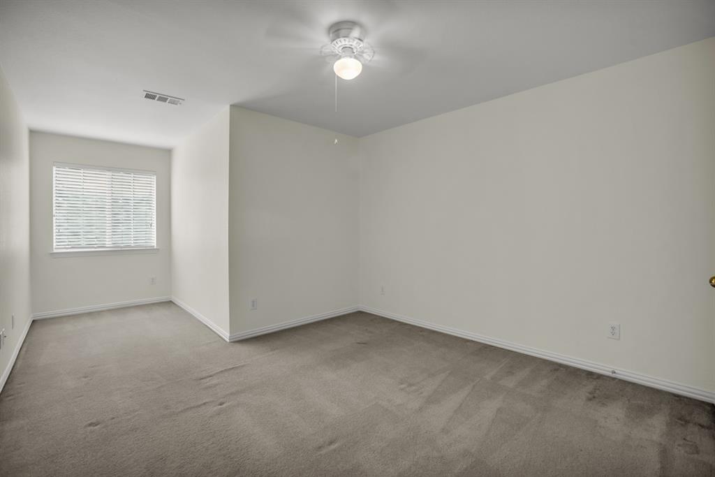 1610 Mapleleaf Falls Drive Allen, TX 75002 - Photo 32 of 36 an empty room with a empty space and windows