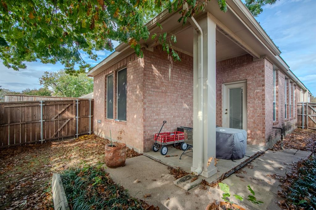 1610 Mapleleaf Falls Drive Allen, TX 75002 - Photo 4 of 36 a view of backyard with small cabin and a chair