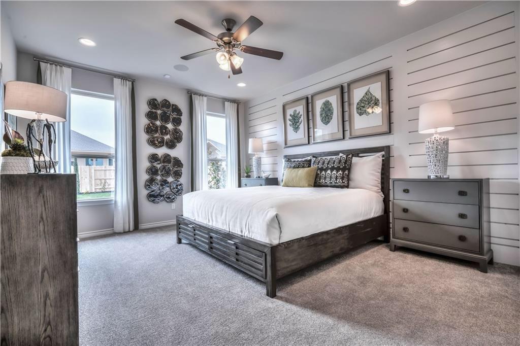 8605 Daisy Cutter Crossing Georgetown, TX 78626 - Photo 11 of 17 a spacious bedroom with a bed a window and closet