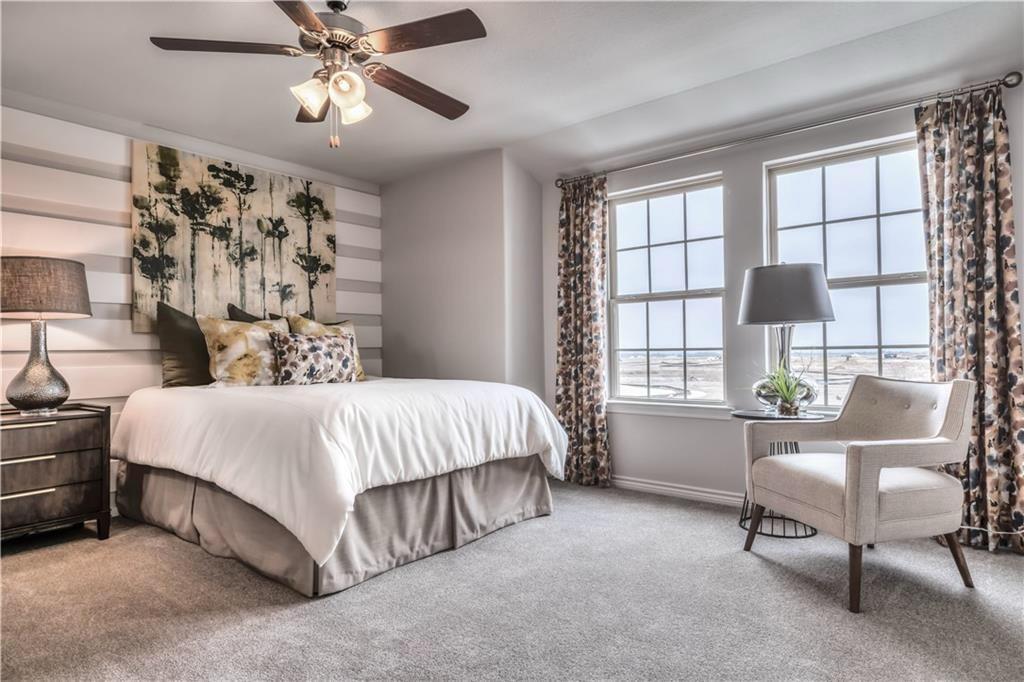 8605 Daisy Cutter Crossing Georgetown, TX 78626 - Photo 10 of 17 a spacious bedroom with a bed and a window
