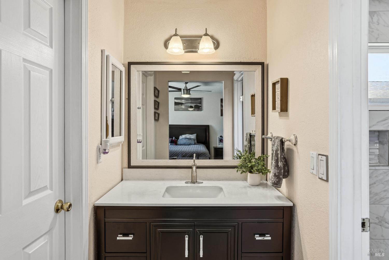 773 Blue Ridge Lane Vacaville, CA 95688 - Photo 31 of 44 a sink with a mirror and vanity