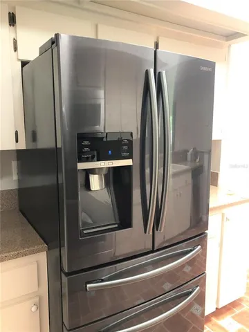 a close view of stove and refrigerator
