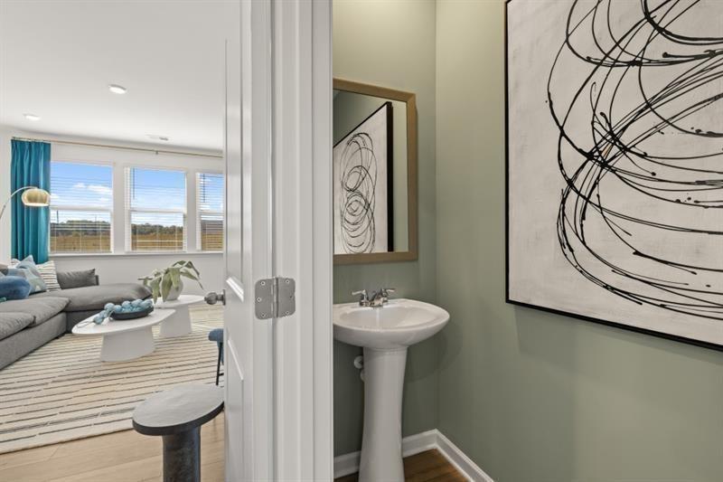 2752 Lou Lou Lane Buford, GA 30519 - Photo 12 of 25 a bathroom with a sink and mirror with bathtub
