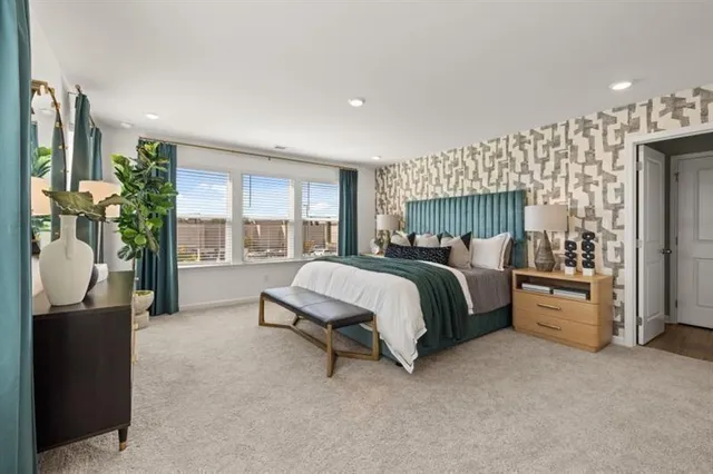 a bed room with a bed and a couch