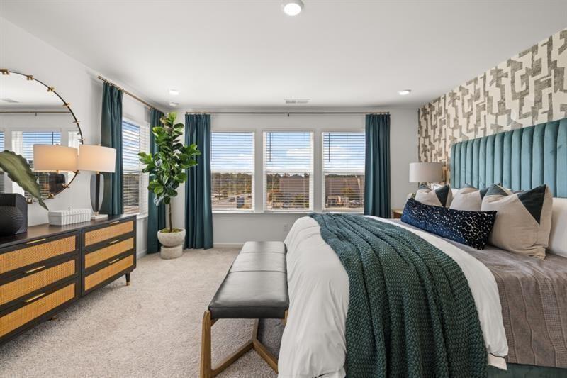 2752 Lou Lou Lane Buford, GA 30519 - Photo 14 of 25 a bed room with a bed and a couch