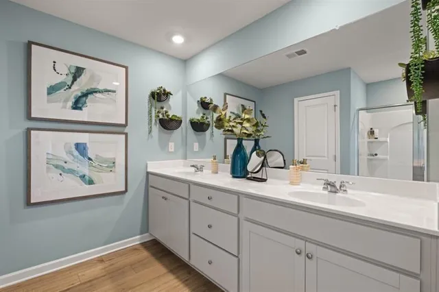 a bathroom with double vanity sinks and a vanity