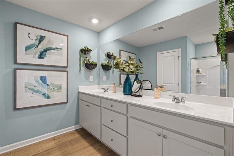 2752 Lou Lou Lane Buford, GA 30519 - Photo 17 of 25 a bathroom with double vanity sinks and a vanity