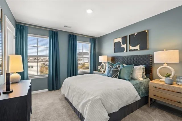 a bedroom with a bed and window