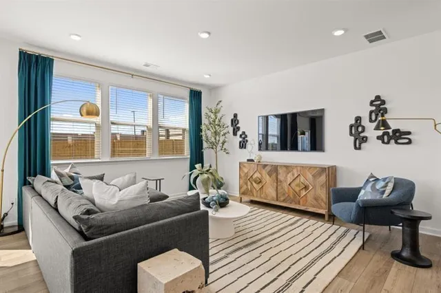a living room with furniture and window