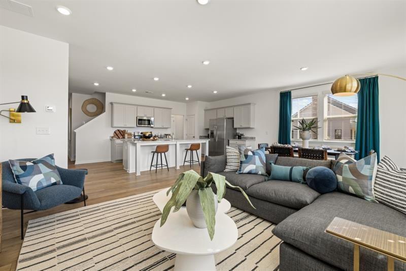 2752 Lou Lou Lane Buford, GA 30519 - Photo 6 of 25 a living room with furniture and wooden floor