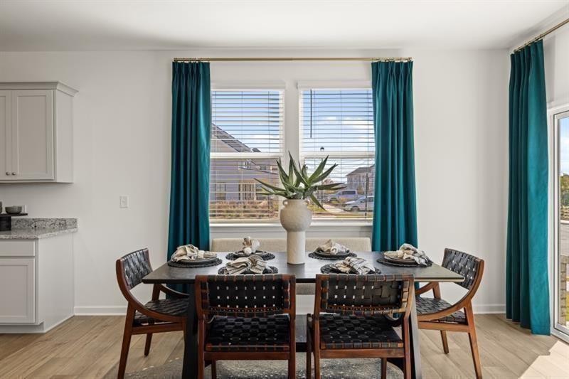 2752 Lou Lou Lane Buford, GA 30519 - Photo 10 of 25 a view of a dining room with furniture and window