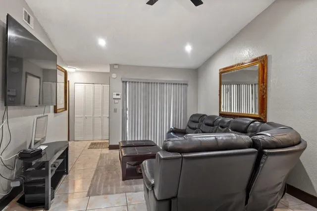 a living room with furniture and a window