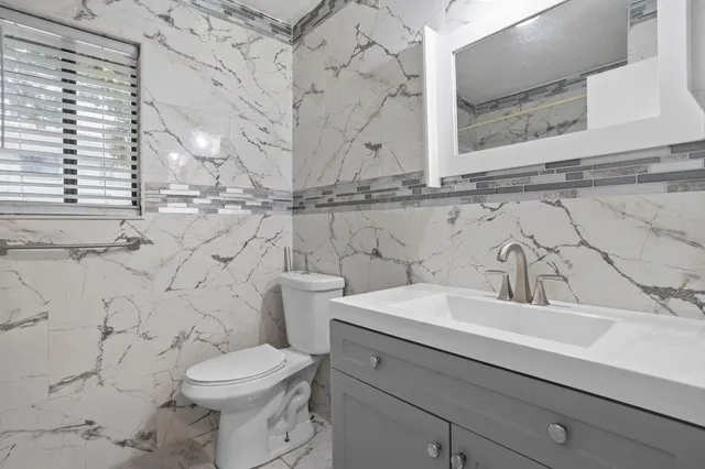 a bathroom with a sink and a toilet