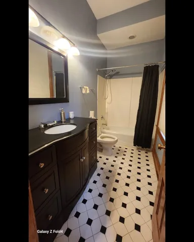 a bathroom with a sink a vanity and a mirror