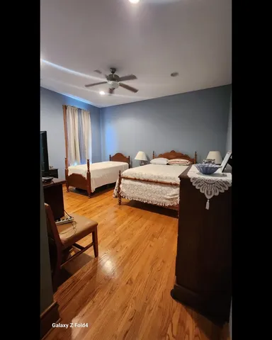 a bedroom with furniture and a chandelier