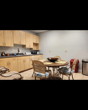 a kitchen with a sink cabinets and window