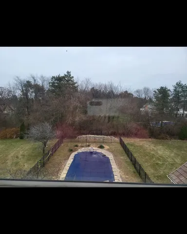 a view of a swimming pool with an outdoor space and seating area