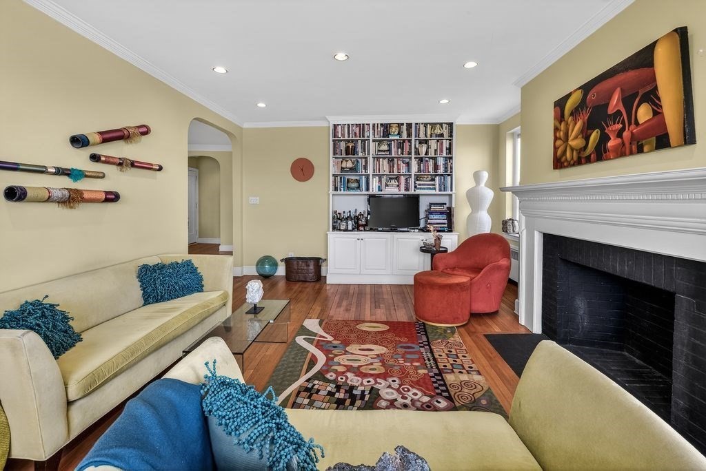 280 Beacon Street, Unit 54 Boston, MA 02116 - Photo 4 of 17 a living room with furniture and a fireplace