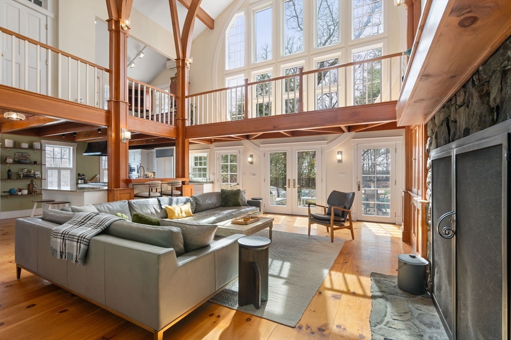 5 Maple Street Sherborn, MA 01770 - Photo 12 of 34 a view of a building with couches chairs and wooden floor