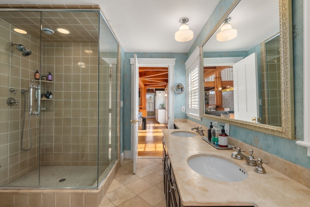 5 Maple Street Sherborn, MA 01770 - Photo 21 of 34 a bathroom with a granite countertop sink a mirror and a shower