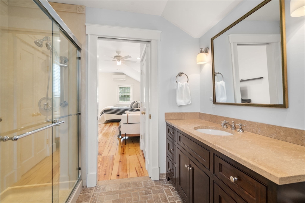 5 Maple Street Sherborn, MA 01770 - Photo 26 of 34 a en suite bathroom with a granite countertop sink and a mirror