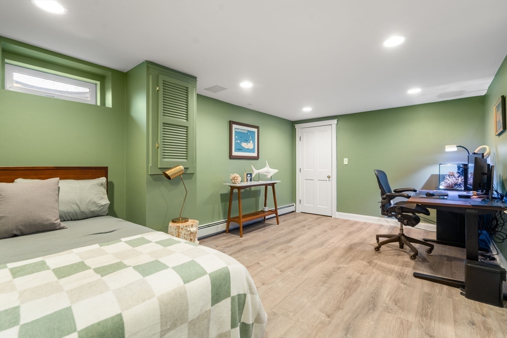 5 Maple Street Sherborn, MA 01770 - Photo 29 of 34 a bedroom with a bed a table and chair