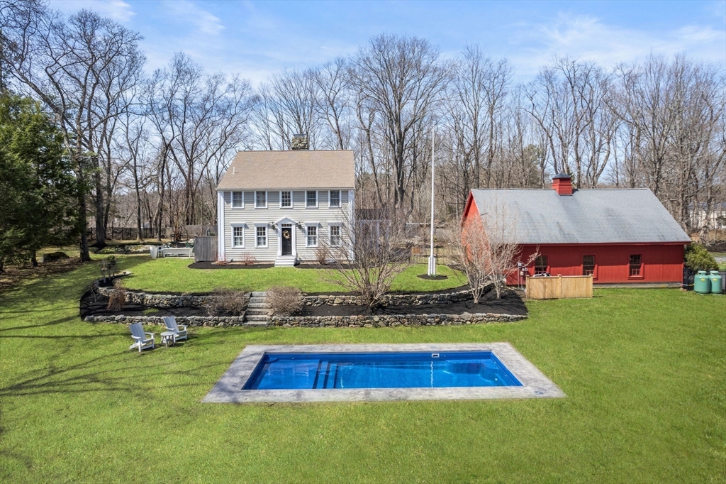 5 Maple Street Sherborn, MA 01770 - Photo 3 of 34 a front view of a house with a yard