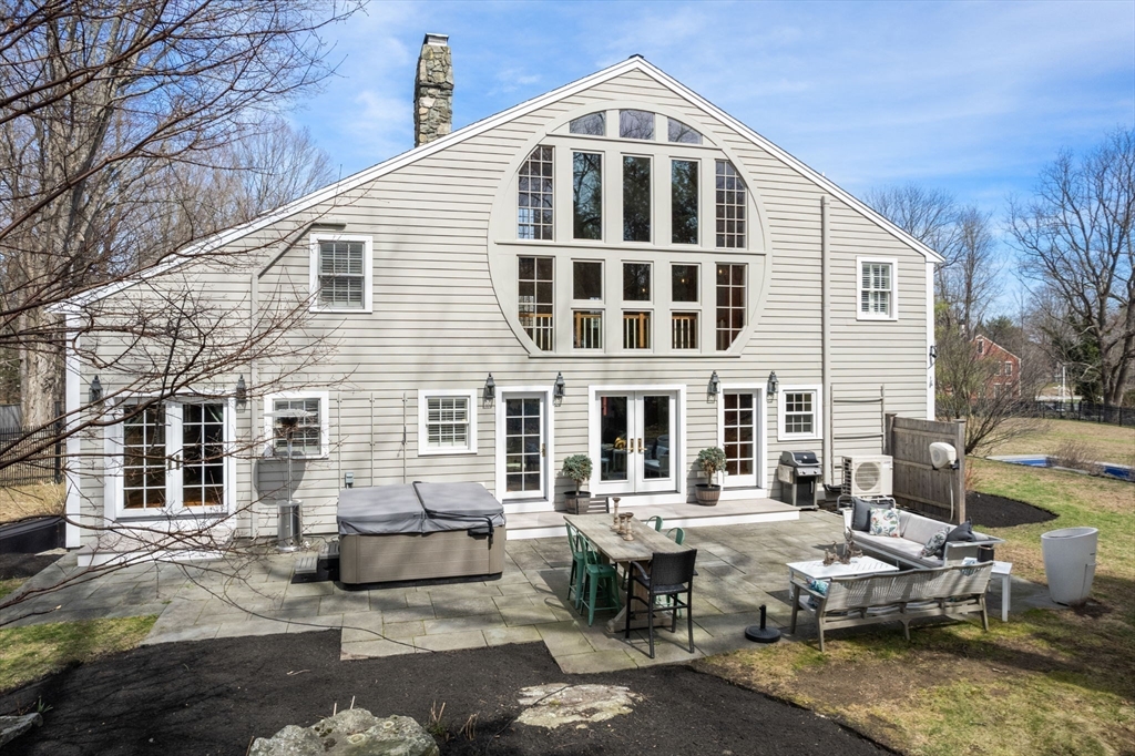 5 Maple Street Sherborn, MA 01770 - Photo 5 of 34 a front view of a house with outdoor seating