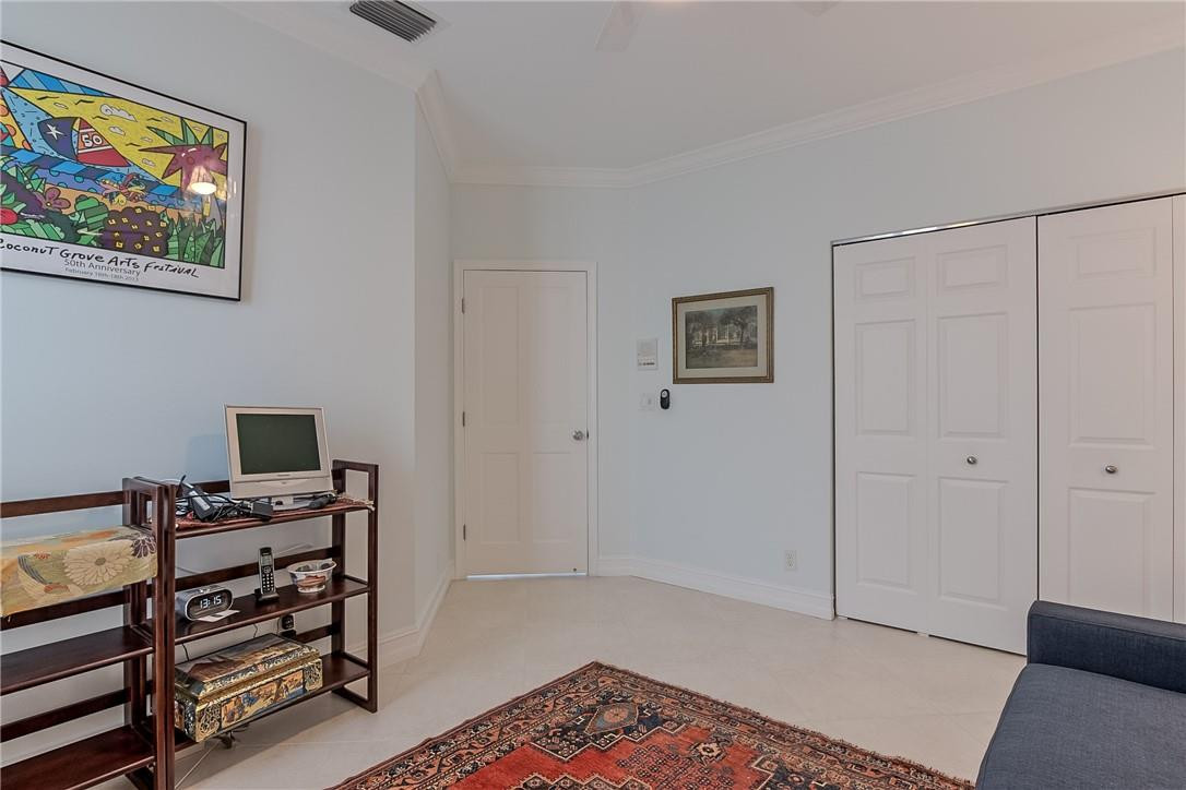 6173 Northwest 23rd Road Boca Raton, FL 33434 - Photo 28 of 60 Large bedroom with crown molding