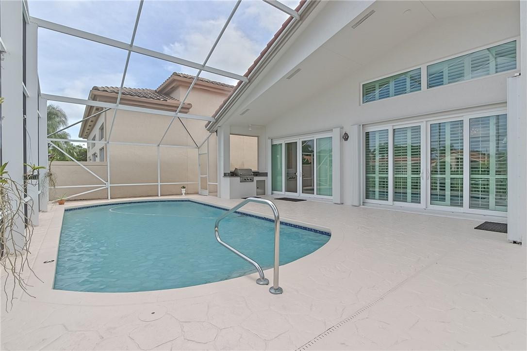 6173 Northwest 23rd Road Boca Raton, FL 33434 - Photo 34 of 60 Large enclosed pool and patio