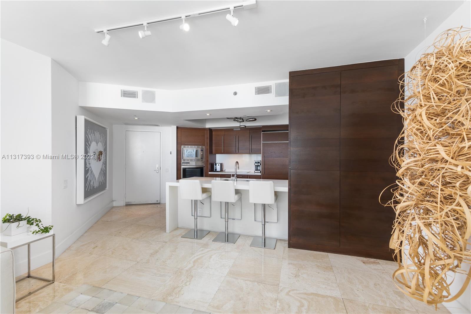 450 Alton Road, Unit 2706 Miami Beach, FL 33139 - Photo 16 of 53 a view of kitchen with furniture and window