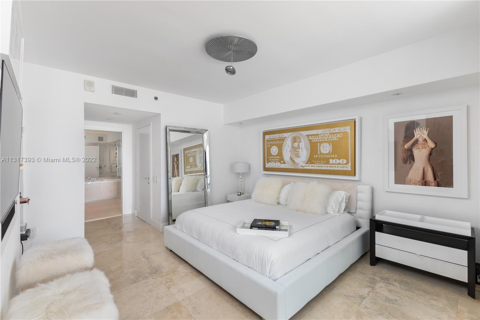450 Alton Road, Unit 2706 Miami Beach, FL 33139 - Photo 18 of 53 a bedroom with a bed and a painting on the wall