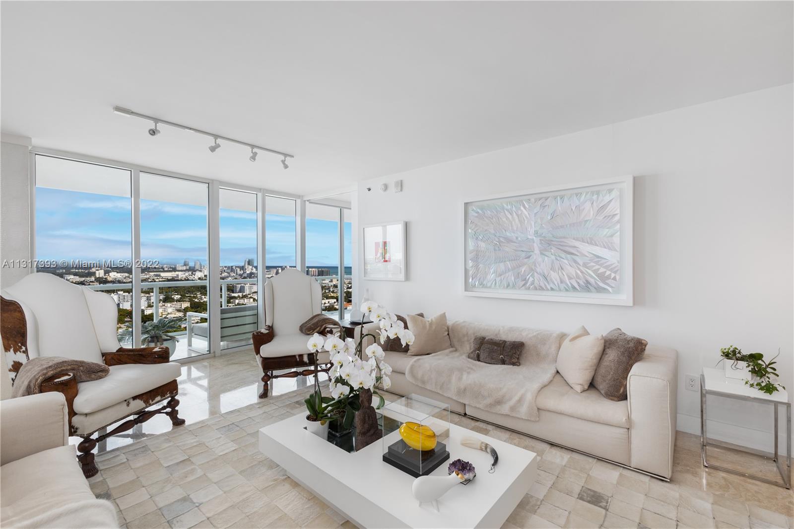 450 Alton Road, Unit 2706 Miami Beach, FL 33139 - Photo 2 of 53 a living room with furniture and view of kitchen