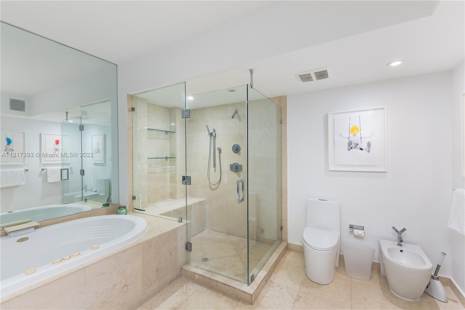 450 Alton Road, Unit 2706 Miami Beach, FL 33139 - Photo 22 of 53 a bathroom with a shower a toilet and a bathtub