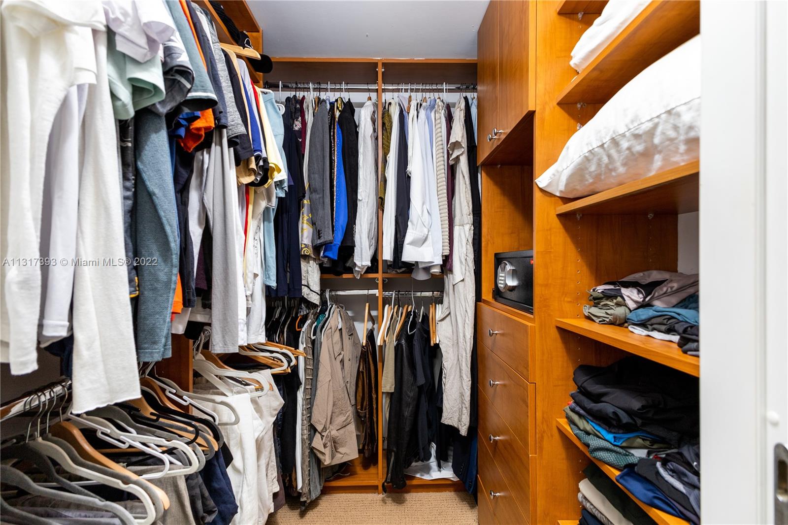 450 Alton Road, Unit 2706 Miami Beach, FL 33139 - Photo 27 of 53 a view of walk in closet with clothes and shoes