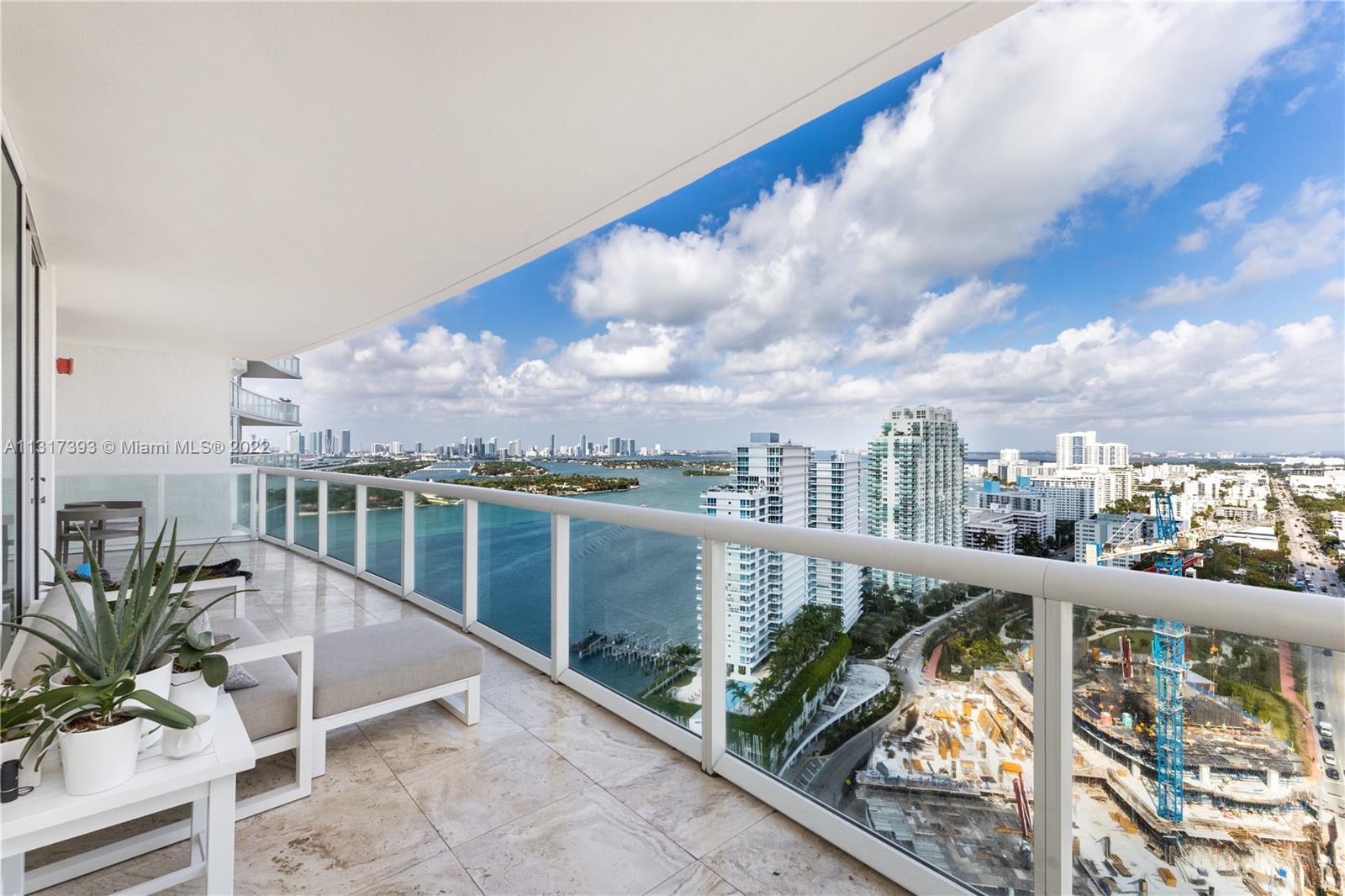 450 Alton Road, Unit 2706 Miami Beach, FL 33139 - Photo 7 of 53 a view of a city from a balcony