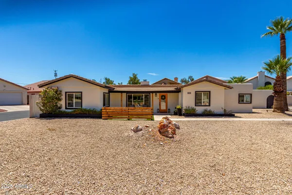 a front view of a house with yard