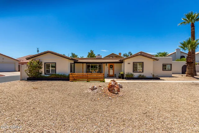 a front view of a house with yard