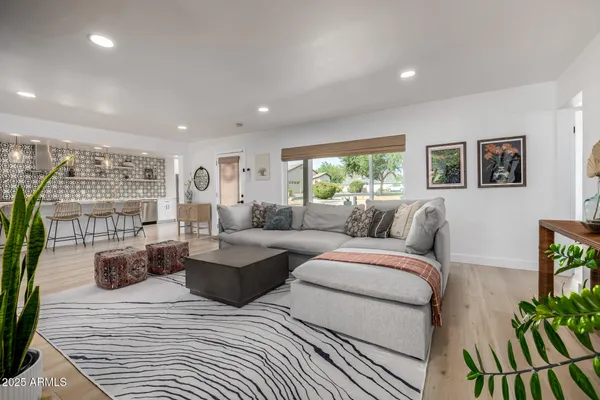 a living room with furniture and a large window