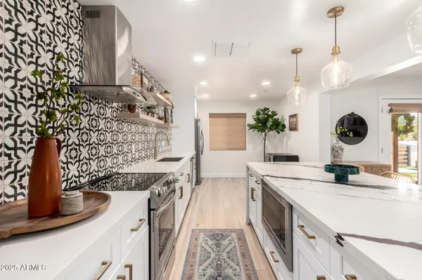 a bedroom with a bed and a potted plant